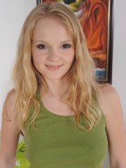 Blonde teen Goldie strips and fingers her shaved pussy on the chair