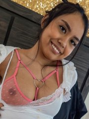 Busty asian amateur Luna Mills peels off her clothes in the bedroom
