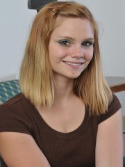 Redhead amateur Brittny strips down to her high heels on the couch