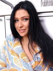 Dark haired babe Rita strips down to her socks in the kitchen