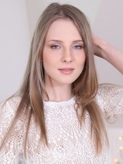 Beautiful brunette Nimfa strips and toys her shaved pussy in the bedroom