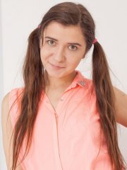 Brunette hottie Alesya strips and poses naked on the couch