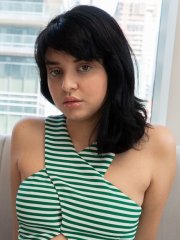 Dark haired amateur Leda Lotharia strips off dress and panties on the couch